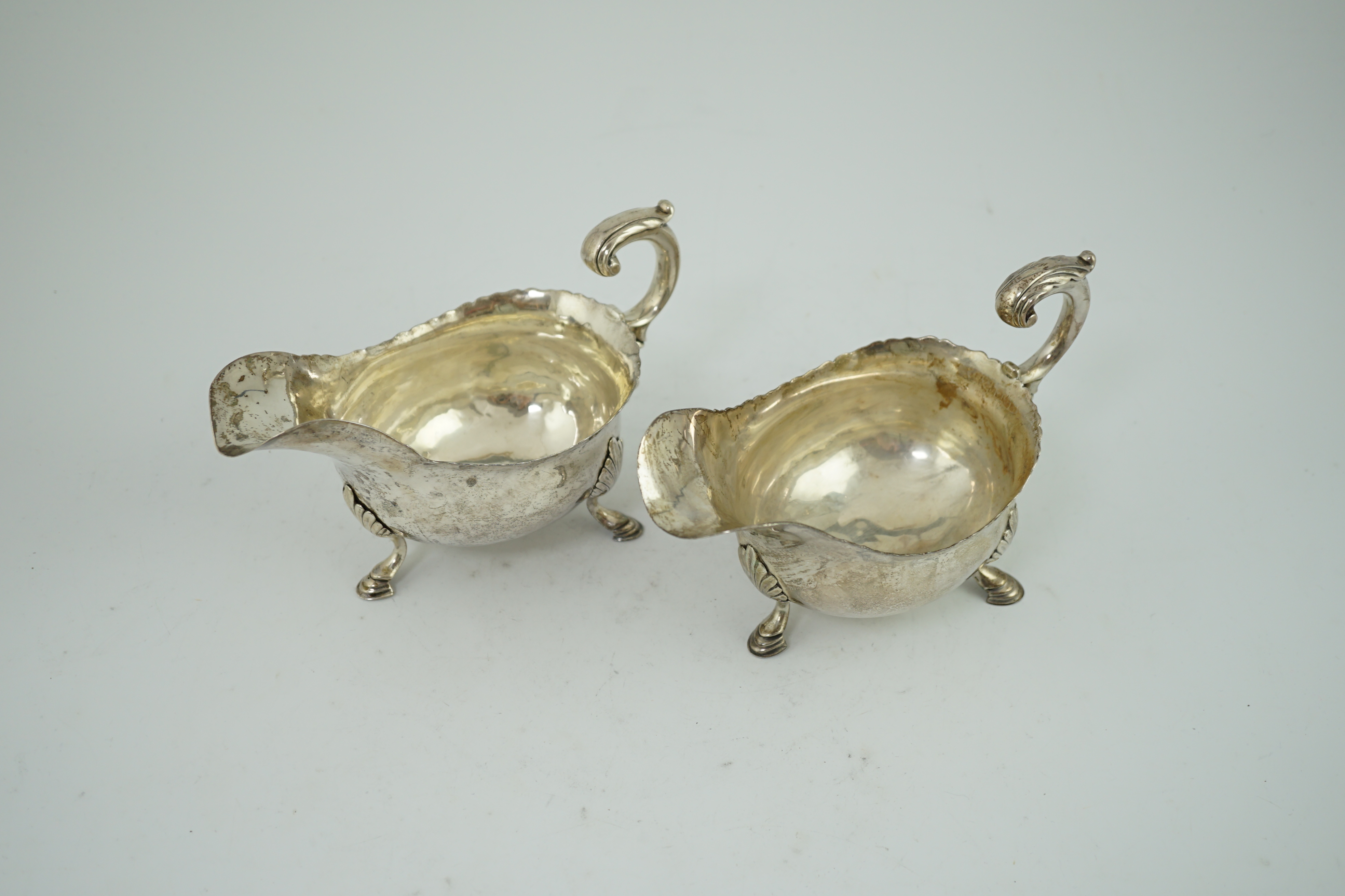 A pair of George III silver sauceboats